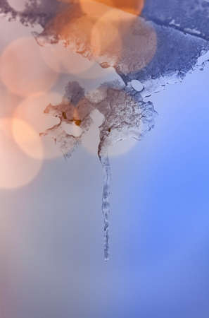 Icicles Hanging From House Eavesの写真素材
