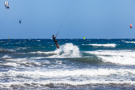 El MÃ©dano, Tenerife, Canary Islands, Spain â€“ 01.03.2026: Kitesurfer riding waves in the...