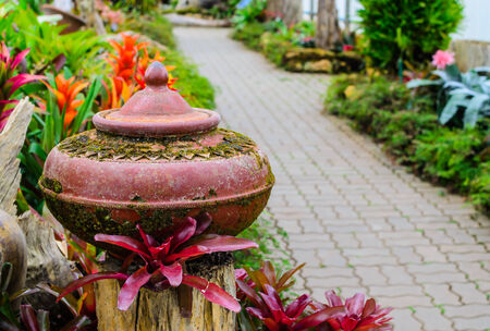 Old water jar use for garden decoration の写真素材