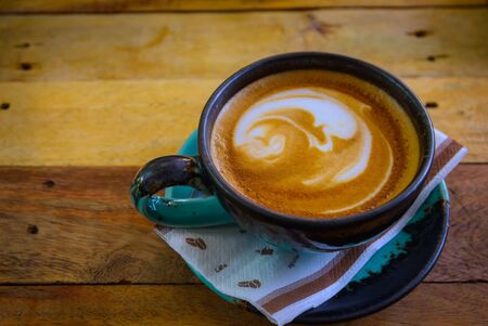 Close up of hot coffee on wood table.の写真素材