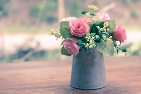 Vintage flowers, beautiful soft pink roses in vase.
