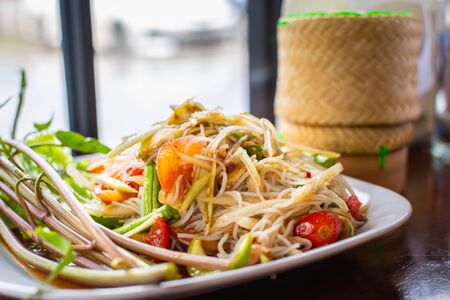 Papaya salad or Som Tum, Thai cuisine spicy one of famous street Thai food.の写真素材