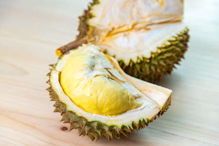 Durian riped and fresh ,durian peel with yellow colour on wooden table.の写真素材