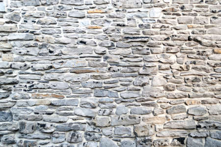 Texture of a Old castle stone wall, background, gray color natural matrialの写真素材