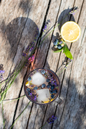 cold refreshing tea with blueberry, lime and lavender on a hot summer dayの写真素材