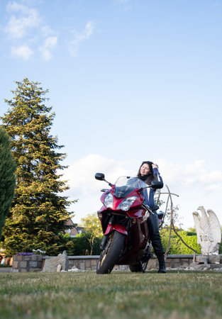 beautiful brunette biker looks into the distance, As,Belgium, May 16,2022のeditorial素材