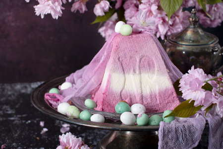 sweet curd orthodox easter on the background of purple sakura, traditional food