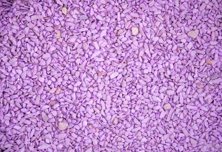 Ultraviolet fine stone texture, lilac surface, small stones backgroundの写真素材