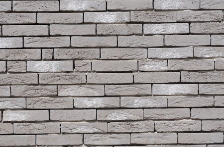 Gray brick wall texture background, stone Facade wall of a new house