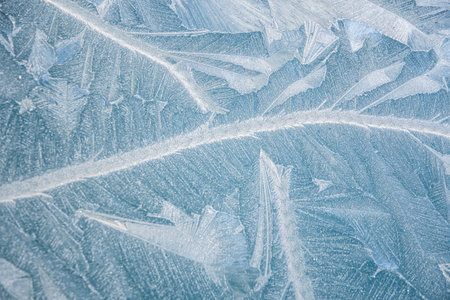 nature draws frost patterns on the glass with the freezing air temperature,abstract winter patternの写真素材