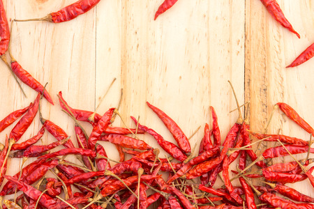 Dried chillies on wooden floorの写真素材