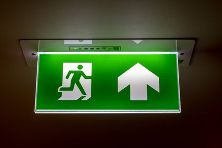 The real safety green sign symbol for go to the fire exit