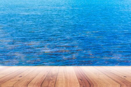Old plank with blue sea background for displaying productsの写真素材