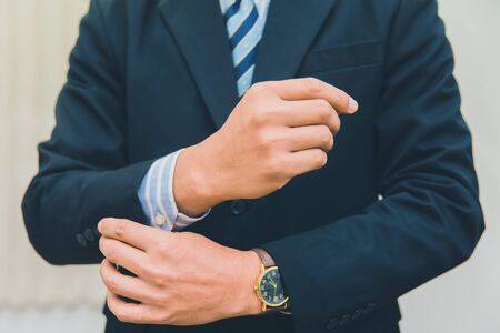 A businessman in a suit is wearing a button shirt.の写真素材