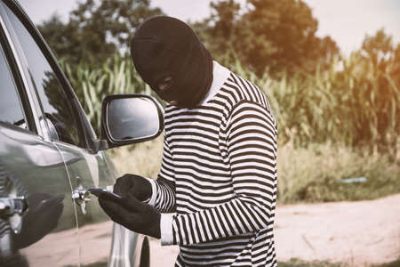 Thieves are about to steal cars.の写真素材