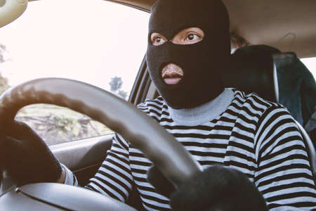 Thieves are about to steal cars.の写真素材