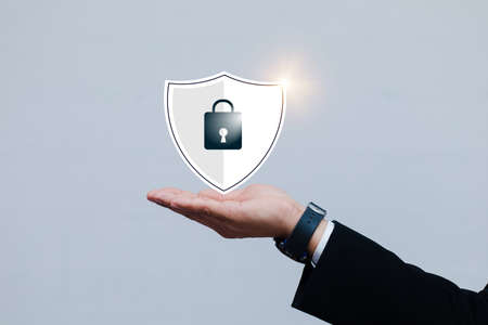 Asian male businessmen with Security lock cyber is a key safe device protection upload backup data on the cloud keep for privacy database.の写真素材