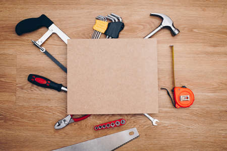 Working tools on wooden background. top view