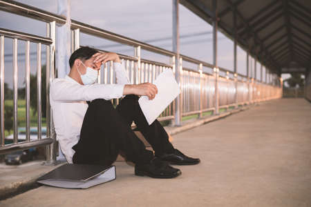 Sad Asian businessman losing jobの写真素材