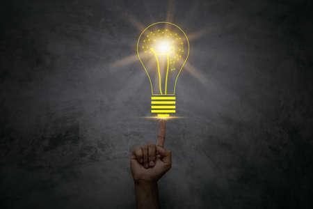 Point a light bulb. An innovative and inspirational concept.の写真素材