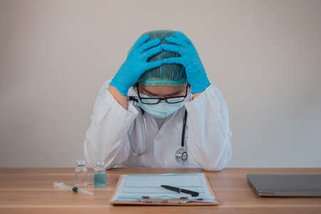 The doctor has stress in the hospital due to hard work.の写真素材