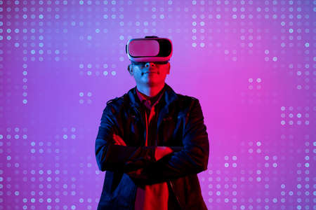 Metaverse digital cyber world technology, man with virtual reality VR goggle playing AR augmented...