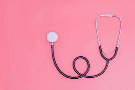 stethoscope on pink background and copy spaceの写真素材