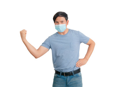Asian man wearing a mask to prevent the spread of coronavirus isolated on white backgroundの写真素材