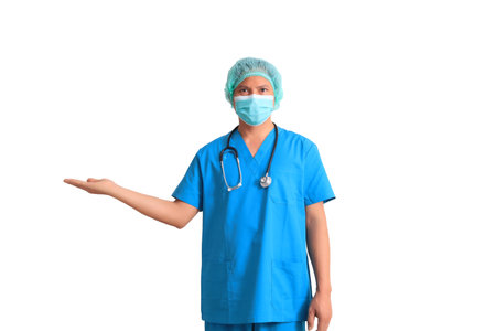 Portrait of a young female doctor in blue scrubs with stethoscope isolated on white backgroundの写真素材
