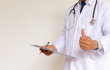 Doctor in lab coat on white backgroundの写真素材