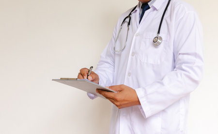 Doctor in lab coat on white backgroundの写真素材
