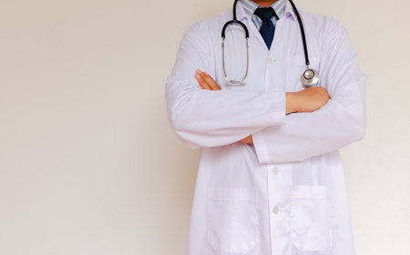 Doctor in lab coat on white backgroundの写真素材