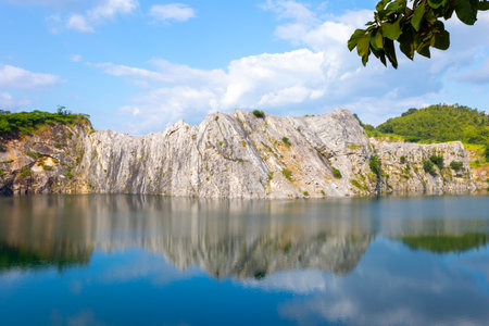 Beautiful view of the lake with rocks and blue sky background.の写真素材