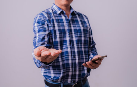 Asian engineer in striped shirt on white backgroundの写真素材