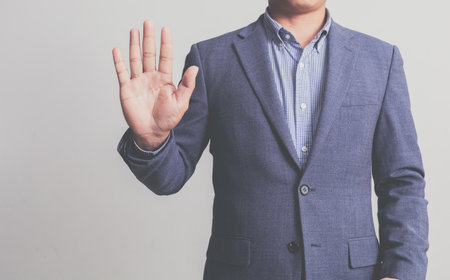Businessman wearing a suit on a white backgroundの写真素材
