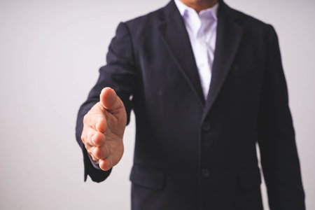 Businessman showing thumb up on white background, business success concept.の写真素材