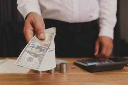 Businessman counting money money saving conceptの写真素材