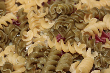 Macro of multi-colored spiral pastaの写真素材