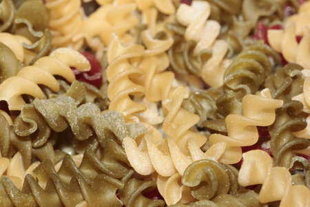 Macro of multi-colored spiral pastaの写真素材