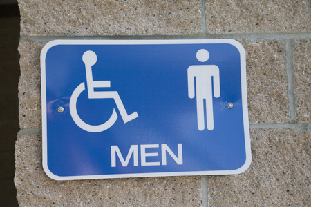 Blue men's restroom sign on wall outdoorsの写真素材