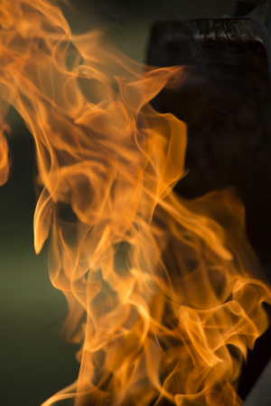 Close-up of flames shooting from grill