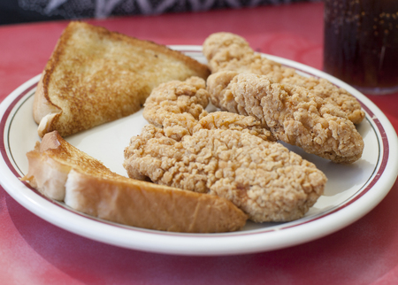 Chicken strips and toastの写真素材