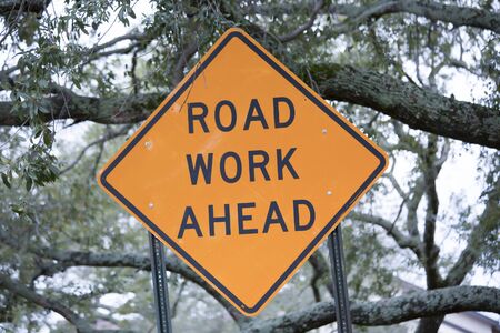 Close up of a road work ahead signの写真素材