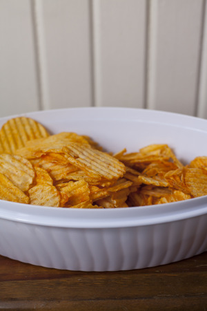 Close up of a bowl of flavored potato chipsの写真素材