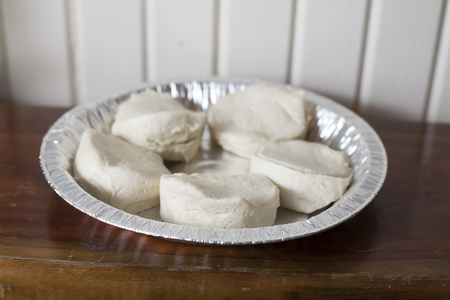 Raw biscuits prepared for cooking in a panの写真素材