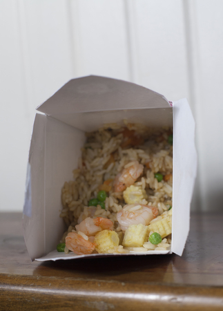 Take out box of shrimp and fried riceの写真素材