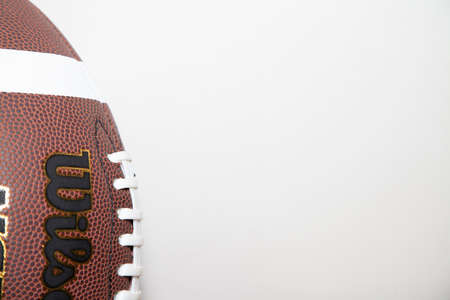 Close-up of football and laces against a white background