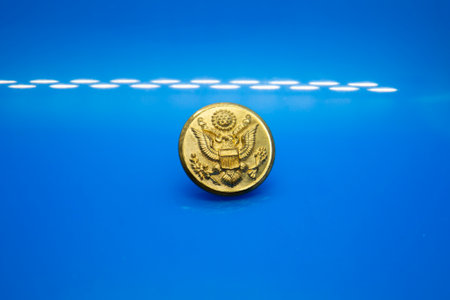 LOUISIANA/USA  â€“ JULY 06 2019: A single golden military button.