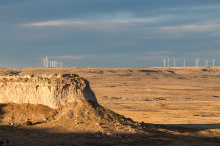 A background of wind turbines, actively generate electricity on the Pawnee National Grasslands in Northeastern Colorado's high plains.の写真素材