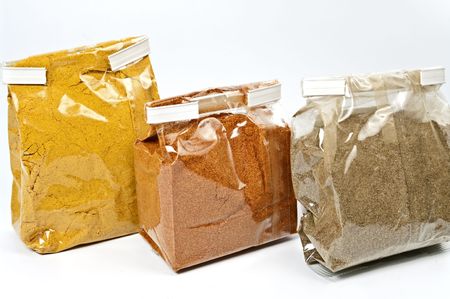 Packs with curry, paprika and pepperの写真素材